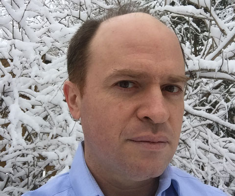 Daneil Wise standing in front of a tree in the winter