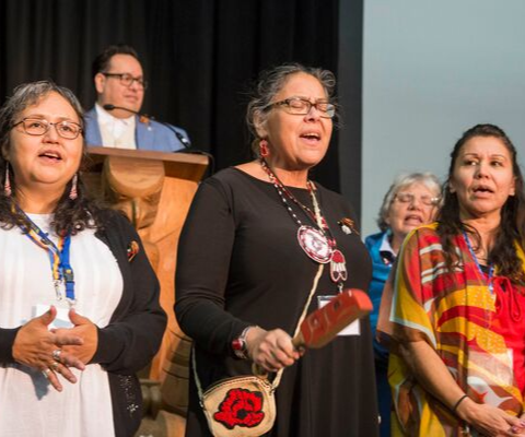 Three Indigenous Elders perform a traditional First Nations song at the 2018 Building Reconciliation Forum.