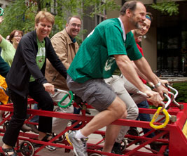 Universities Canada employees riding the big bike