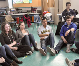 students sitting on floor