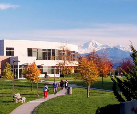 Campus of University of The Fraser Valley with the Coast Mountains in the background.