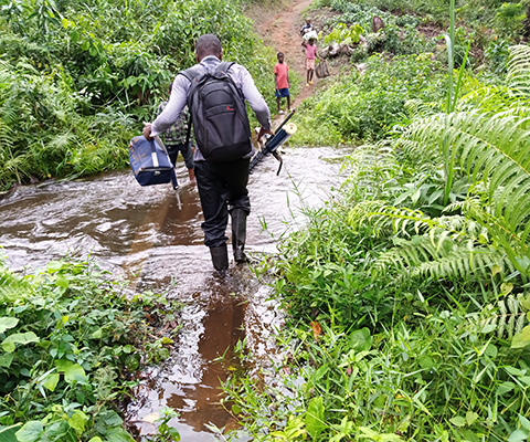 Guy Donald Abassombe, doctoral researcher from Cameroon working with York University deploying on foot to remote areas to hold training seminars in villages
