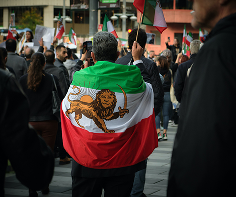 Man with Iran flag on protest
