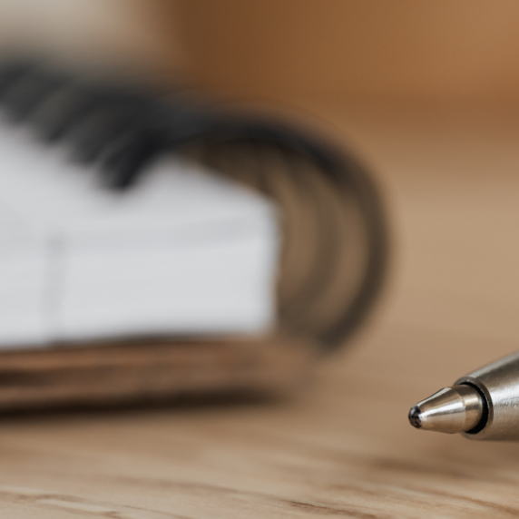 Close up of pen with spiral notebook