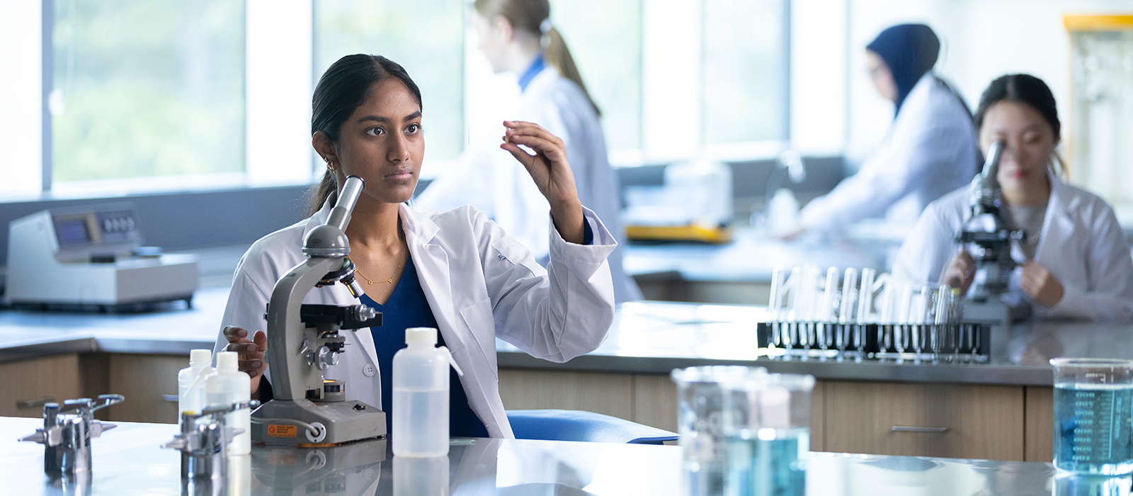 Four student researchers in a lab