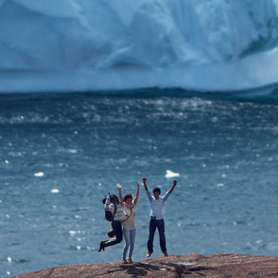 Students standing by an iceberg