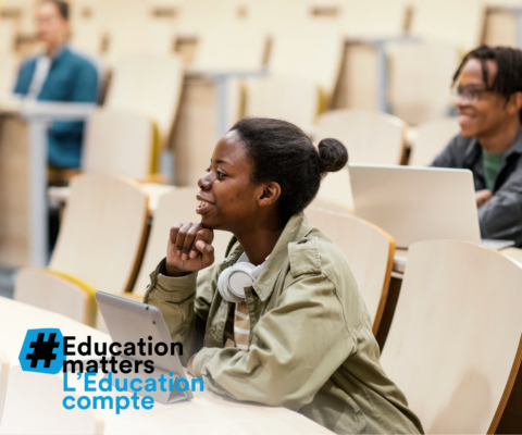 Students on tablet and laptop in classroom setting