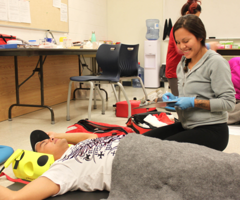 Two students participating in medical education practices