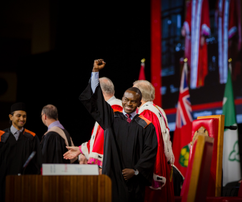 Student at Convocation cheering