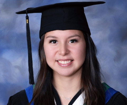 Grace Tuglavina wearing Black graduate cap