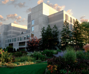 Outside view of campus with trees an flowers