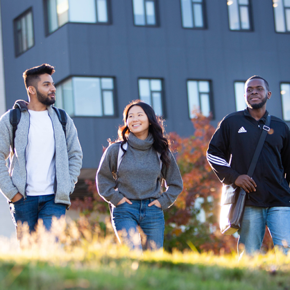 Three students walking together