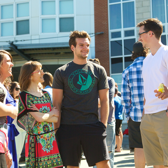 Students talking with each other outside of a campus building