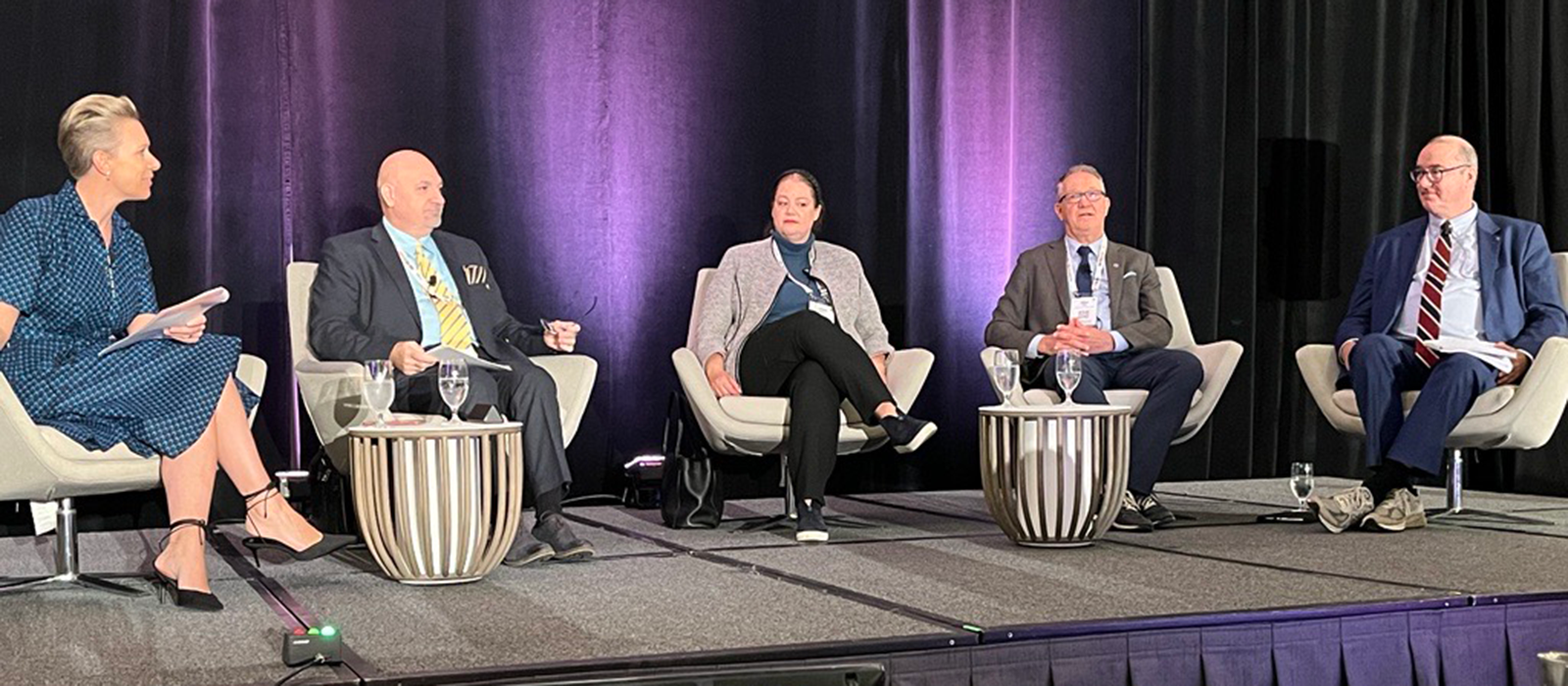 Five people, including Universities Canada president Paul Davidson, sitting next to each other as part of a panel discussion