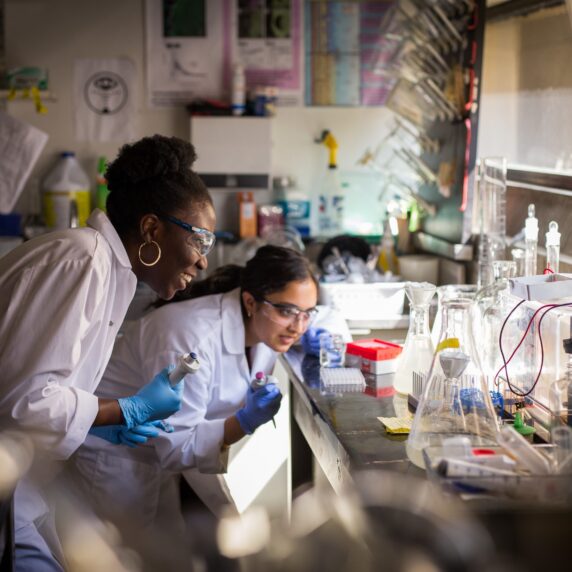 Two students working in a research lab.