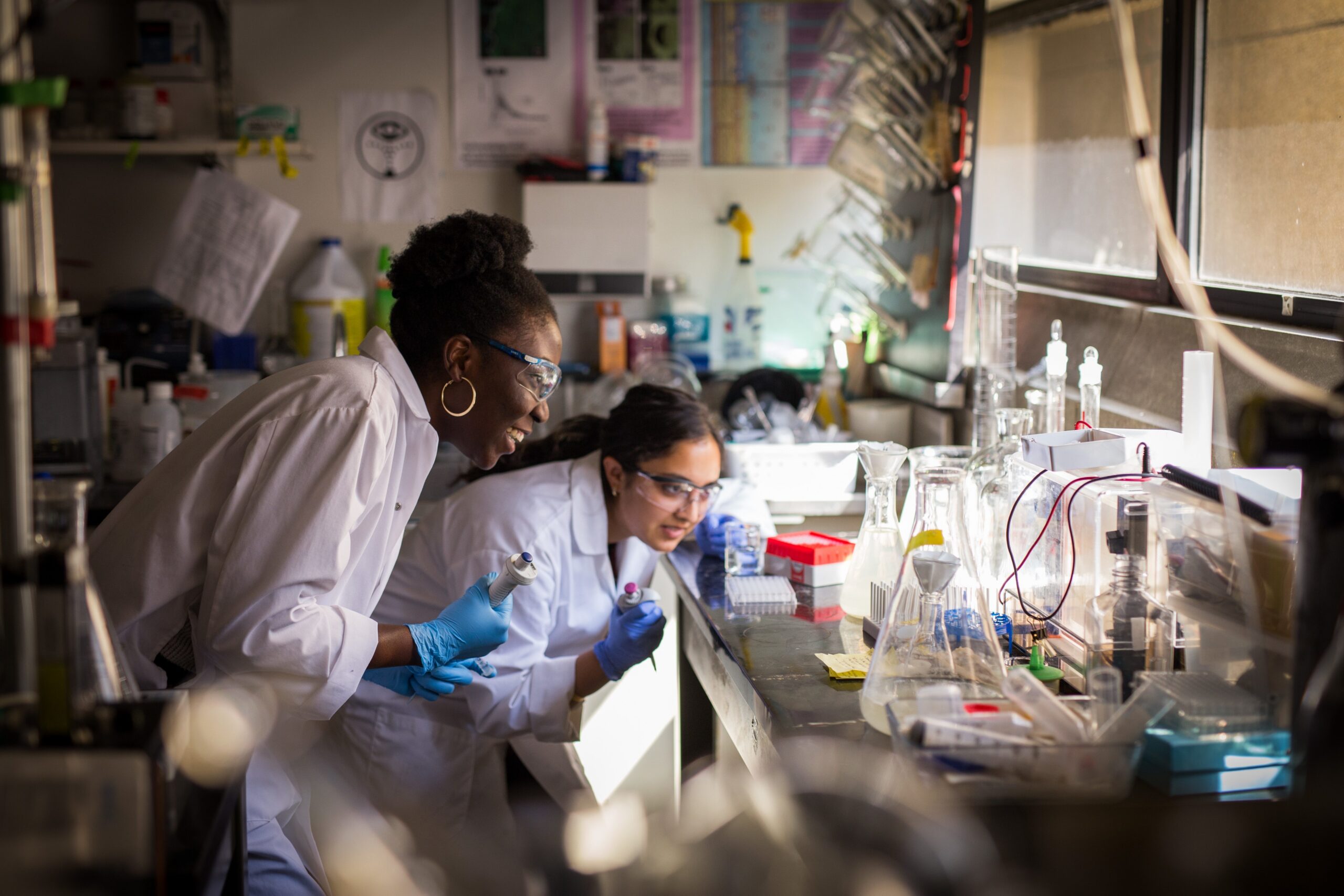 Two students working in a research lab.