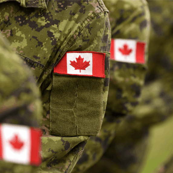 Photo of military fatigues with Canadian flag patches.
