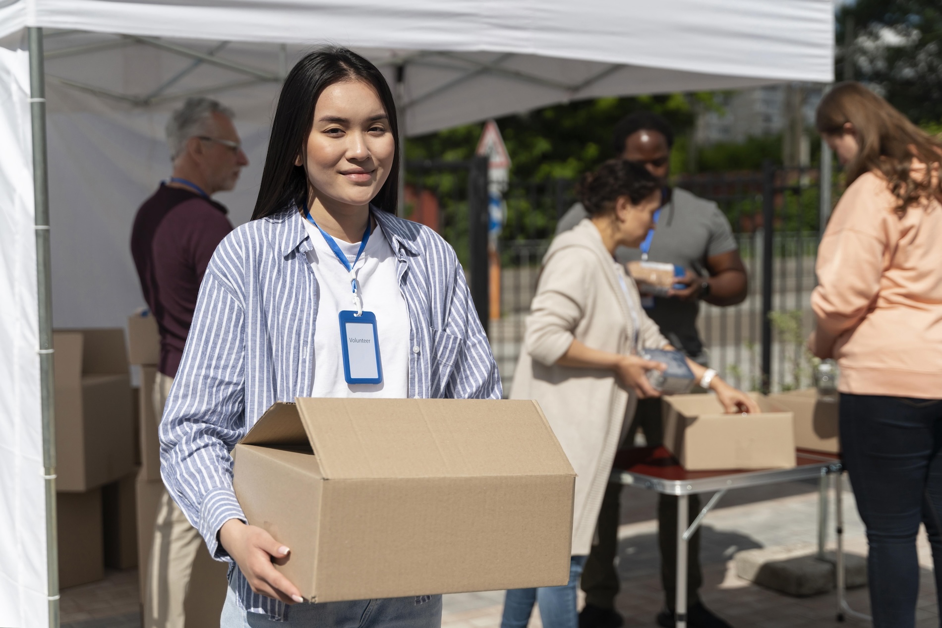 Volunteer at a food bank smiling for photo