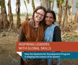 Inspiring leaders with global skills. Photo of two smiling people with trees in background