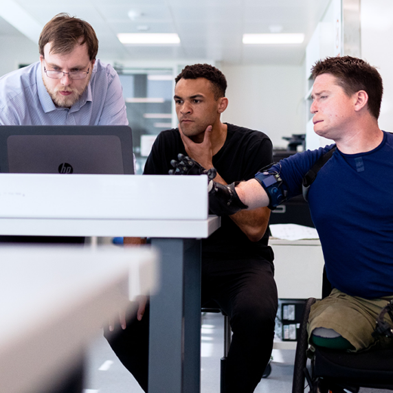 3 person working on Computer