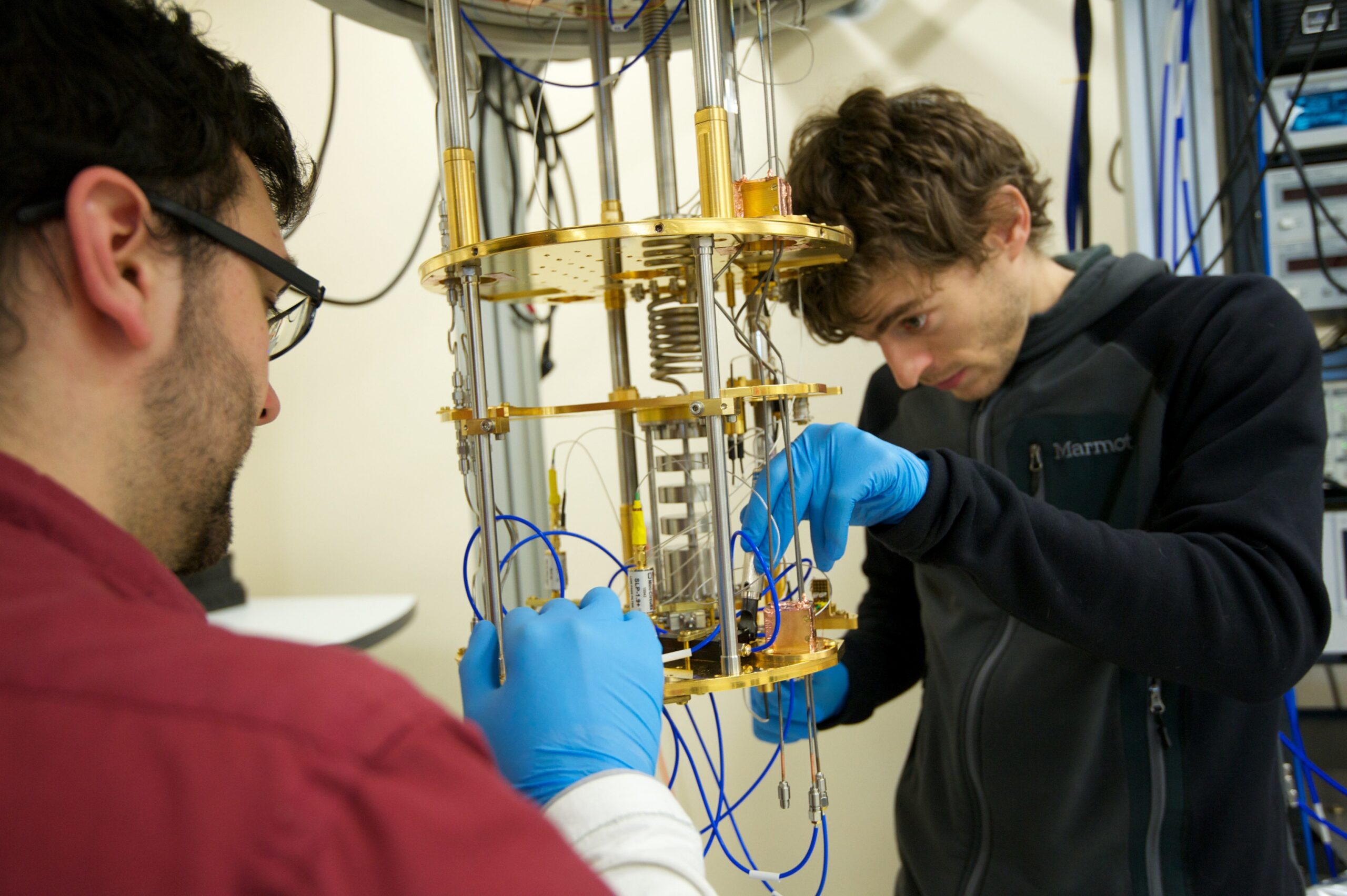 Photo of two students working in a quantum signal processing lab.