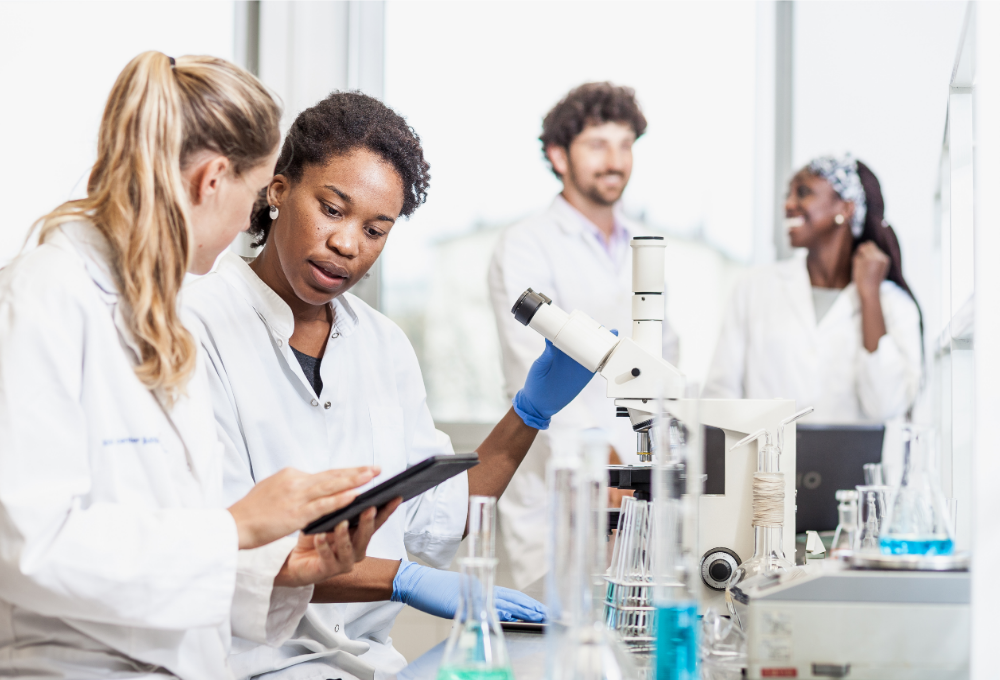 A diverse group of scientists collaborating in a research lab.